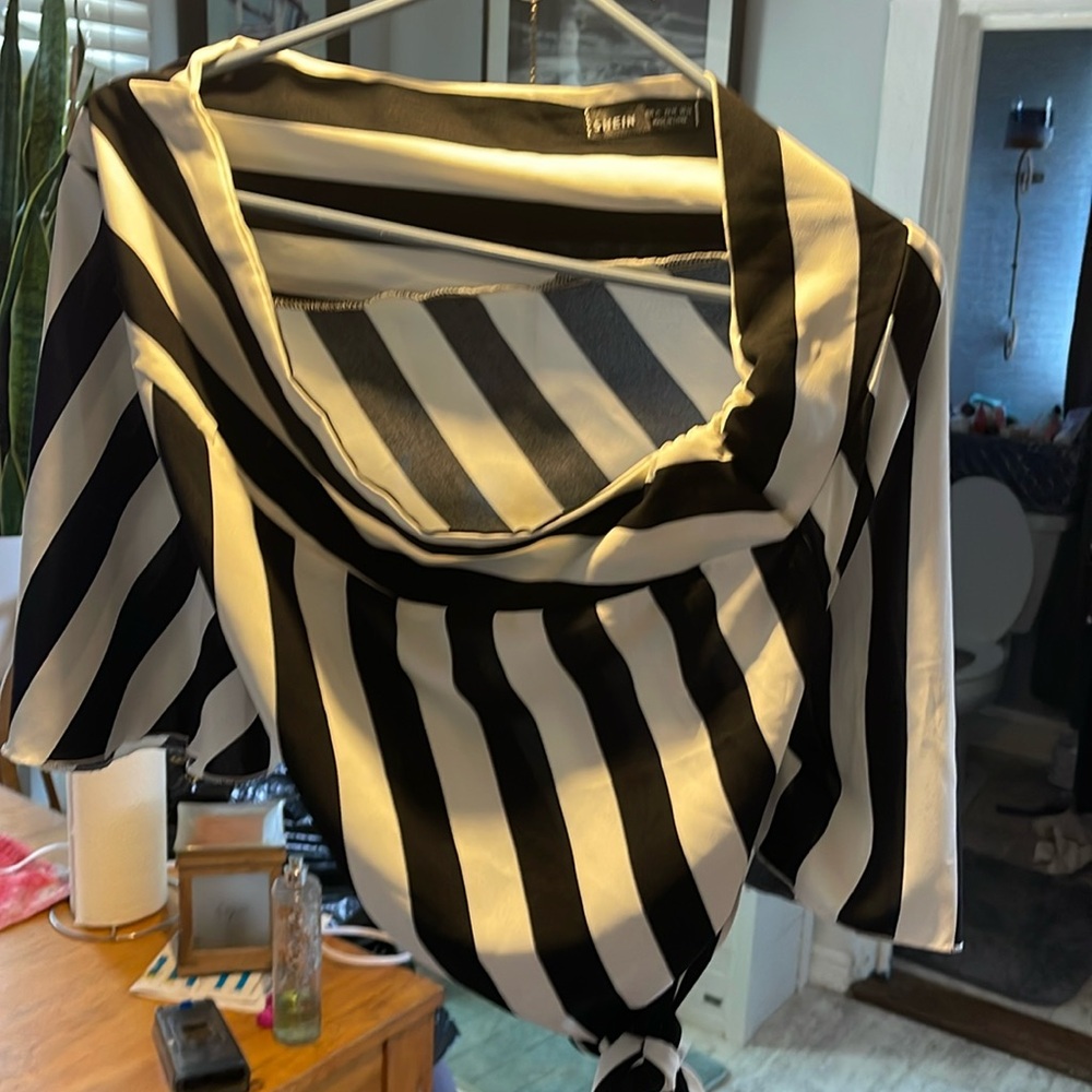 Size large black and white off the shoulder blouse , with optional tie belt
